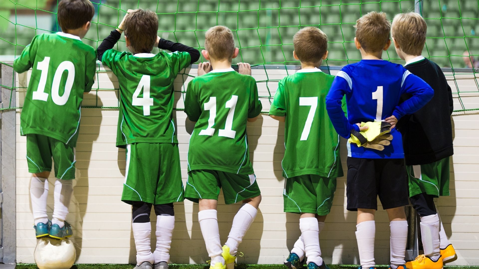 Boys in soccer jerseys getting ready to play indoor soccer Boys in soccer jerseys getting ready to play indoor soccer