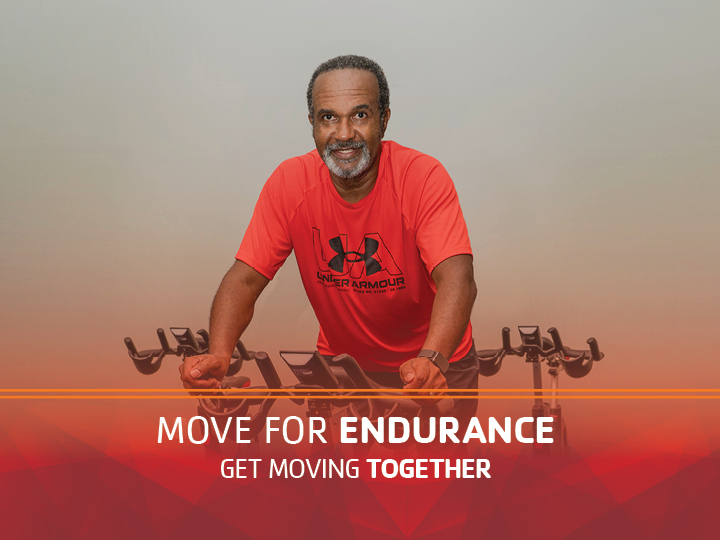 Man on group exercise bike Man on group exercise bike