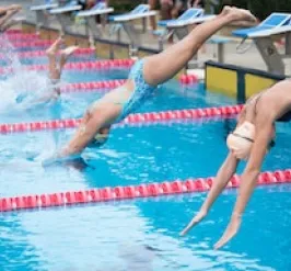 YMCA Louisville swim team members diving