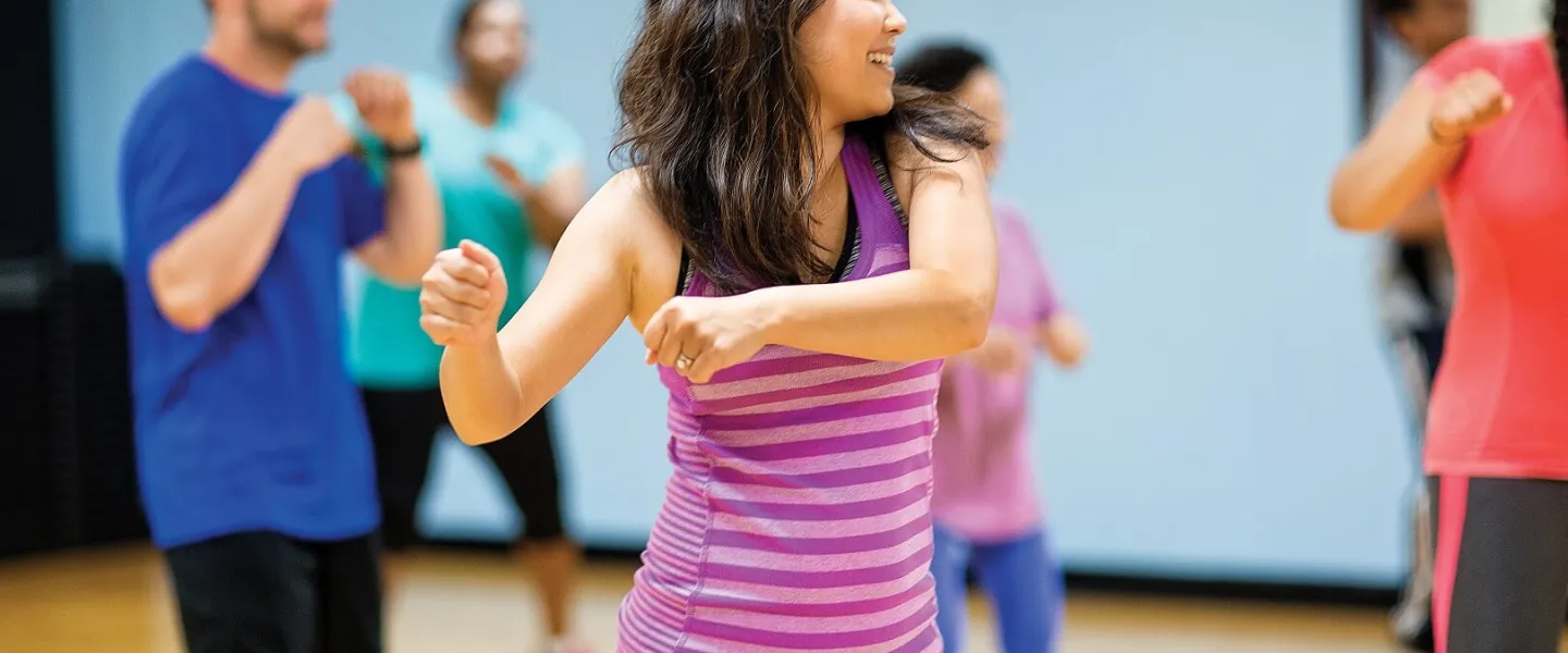Adults dancing at group dance class at YMCA Louisville