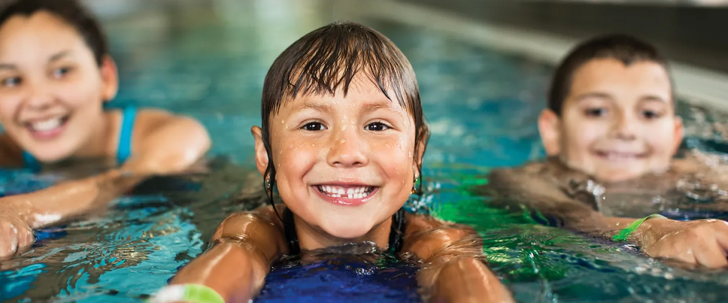 Children swimming at YMCA Louisville swimming pool