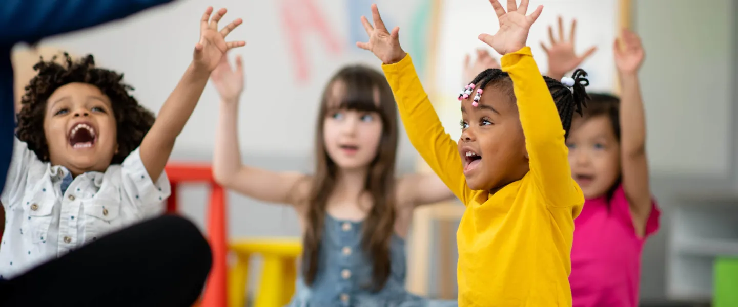 Children shouting in joy at YMCA child development center