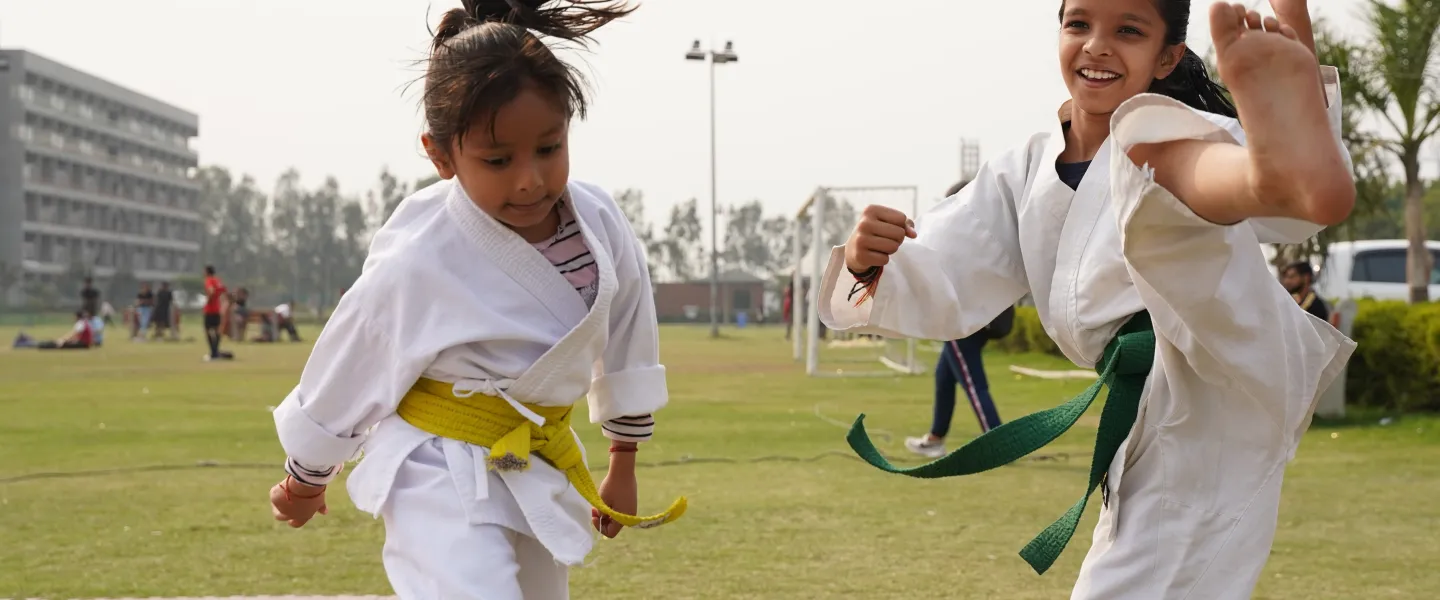 Kids practicing martial arts outdoors