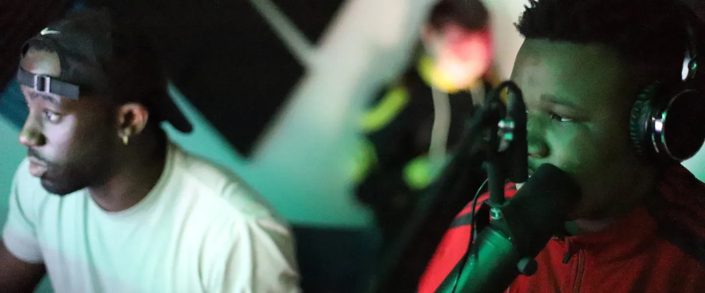 2 teens working in the recording studio