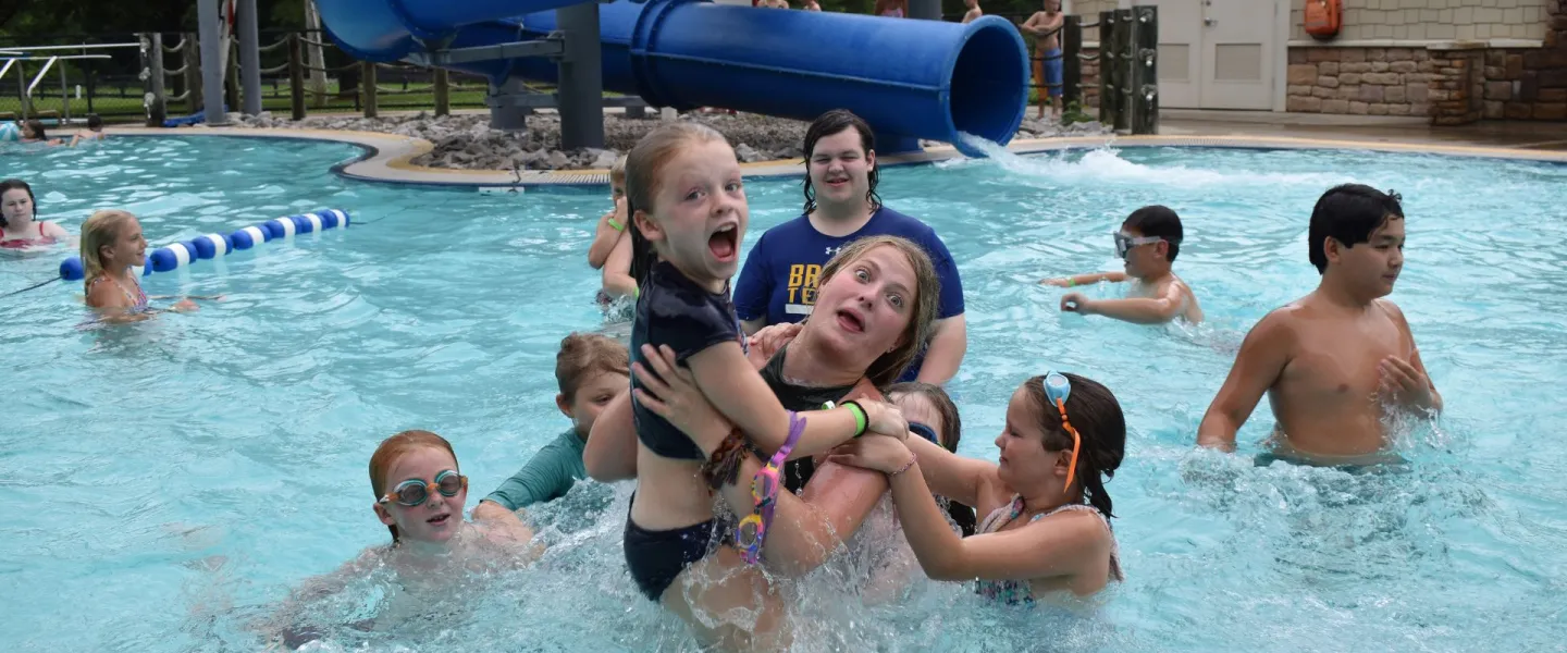 Group of campers having fun in the pool at YMCA Camp Piomingo