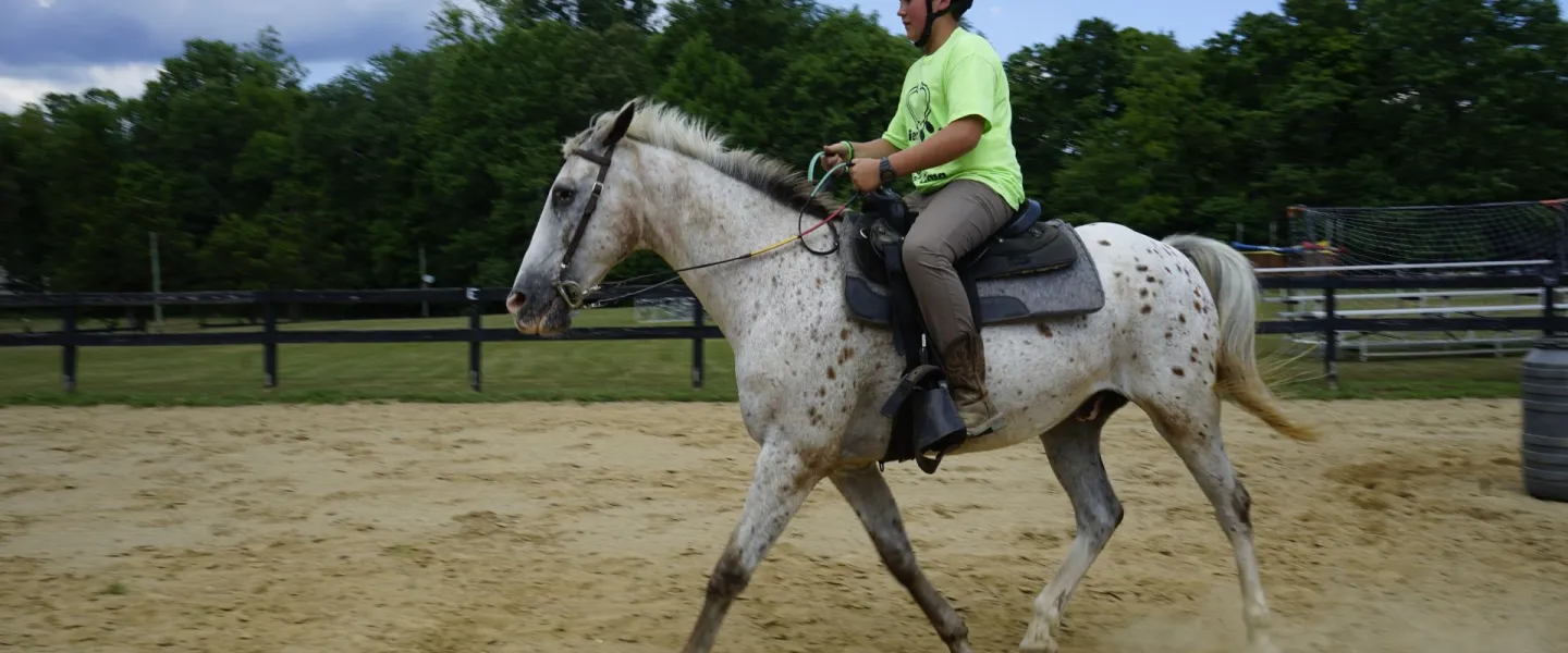 Camper riding a horse at YMCA Camp Piomingo