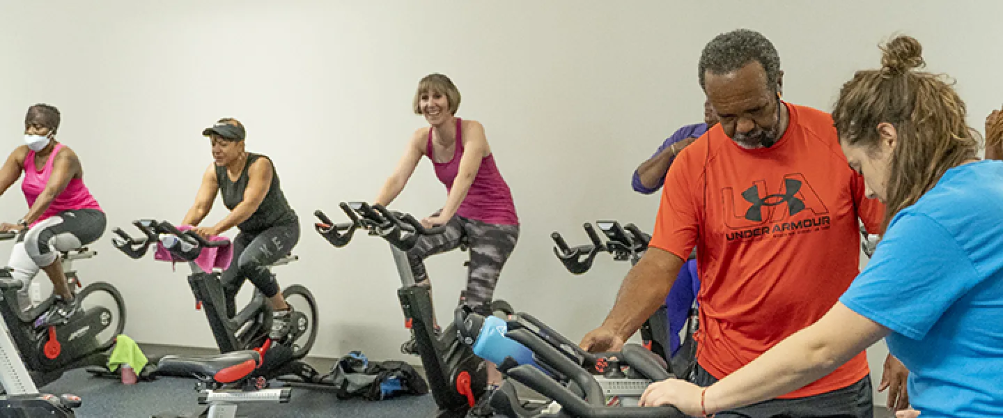 Group of people in a YMCA cycling class