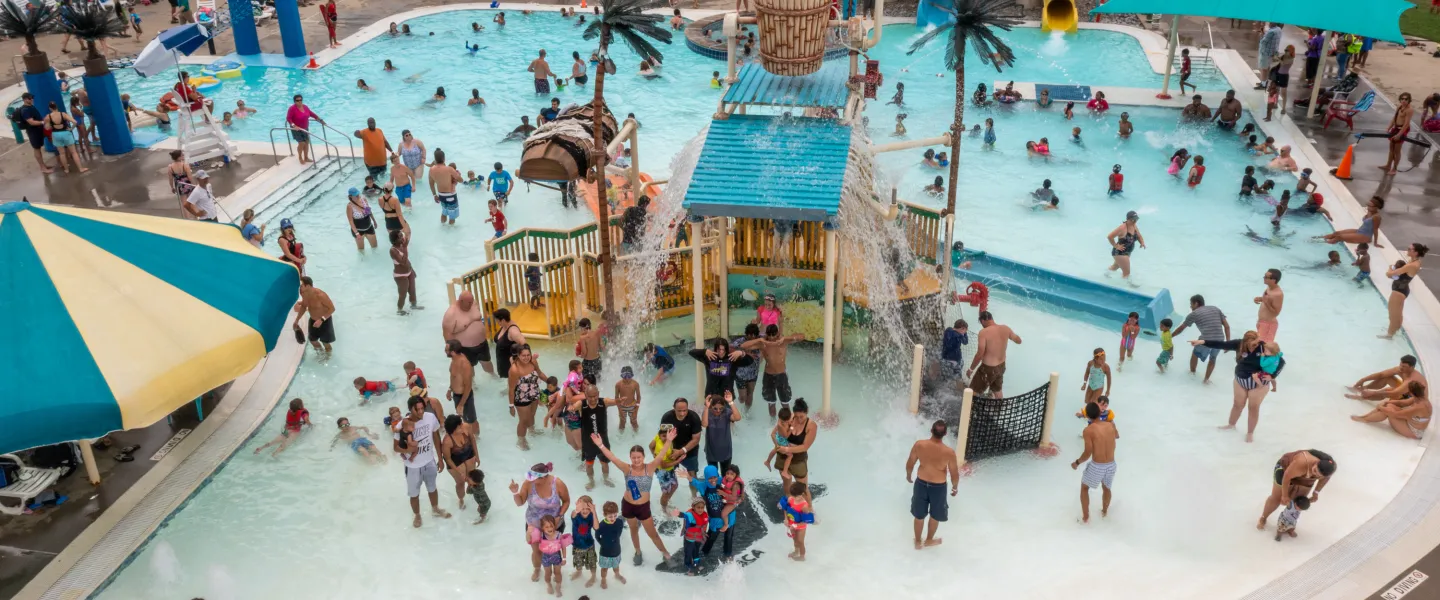 Large group of people having fun at Calypso Cove