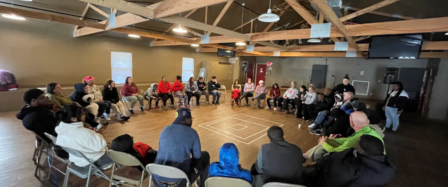 Group of people sitting at a large round table
