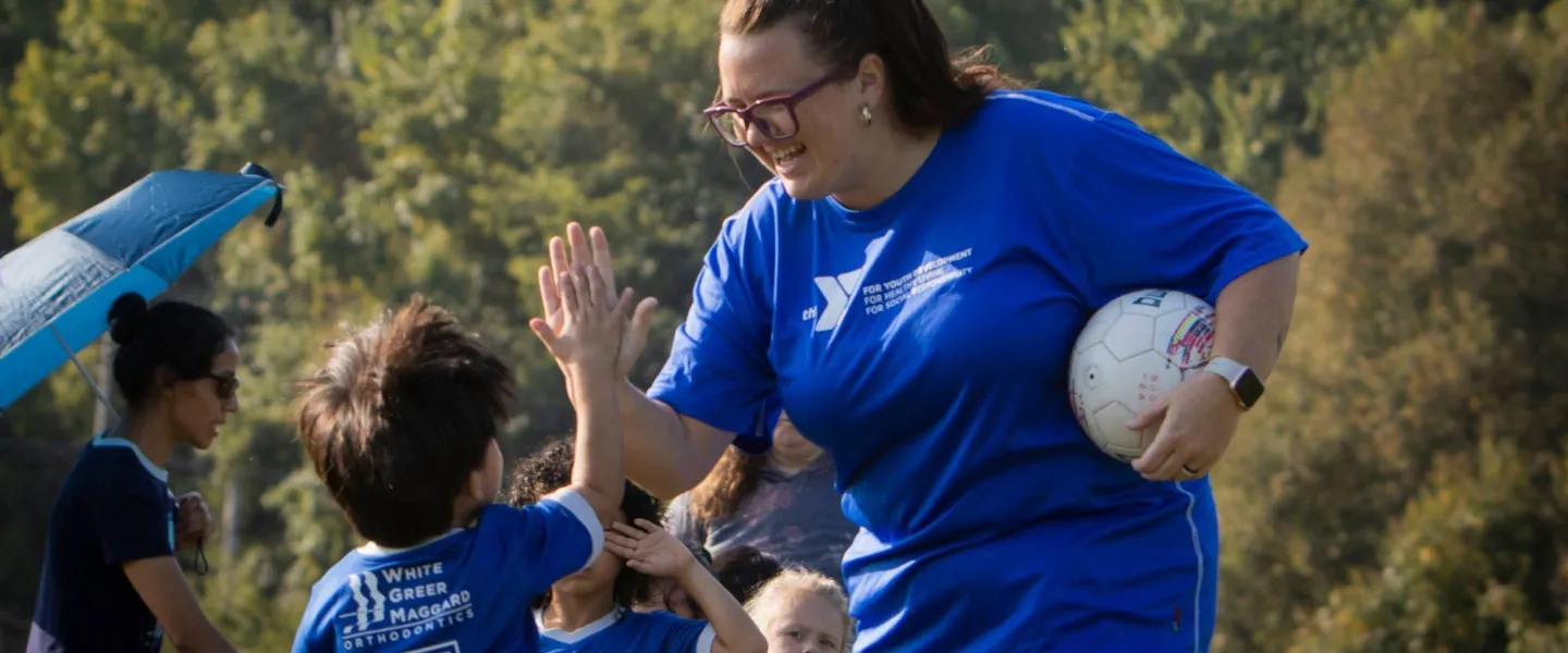 Woman and child high fiving
