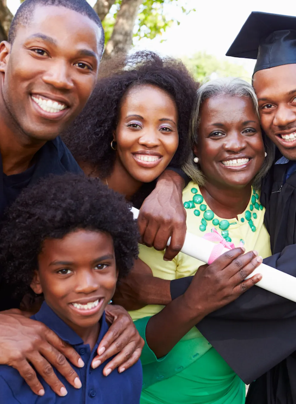 Family smiling together at graduation