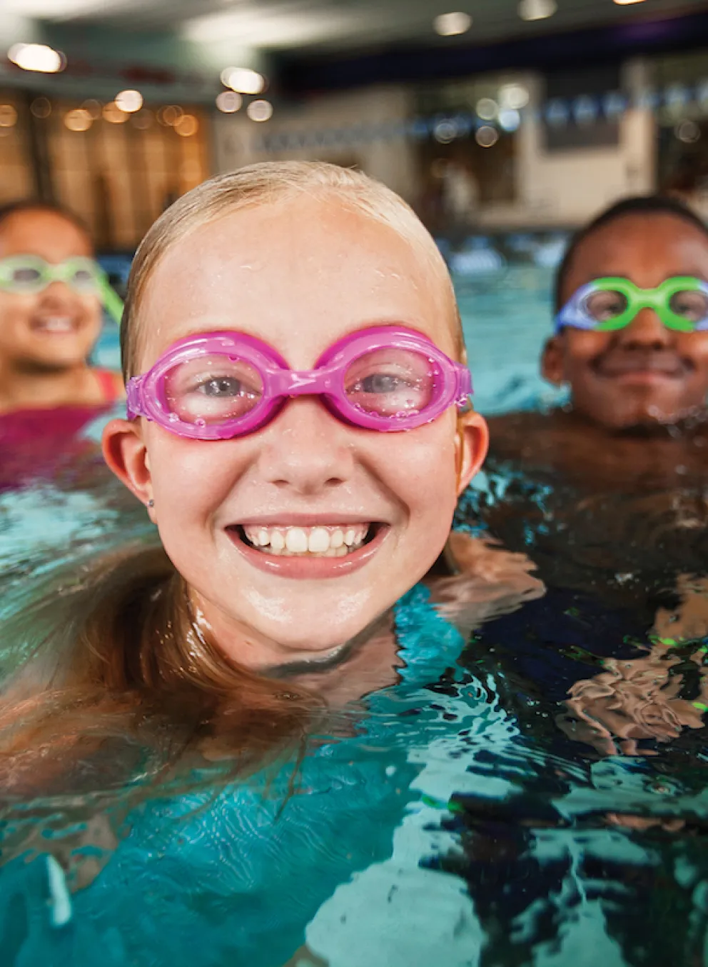 Children swimming at YMCA Louisville swimming pool