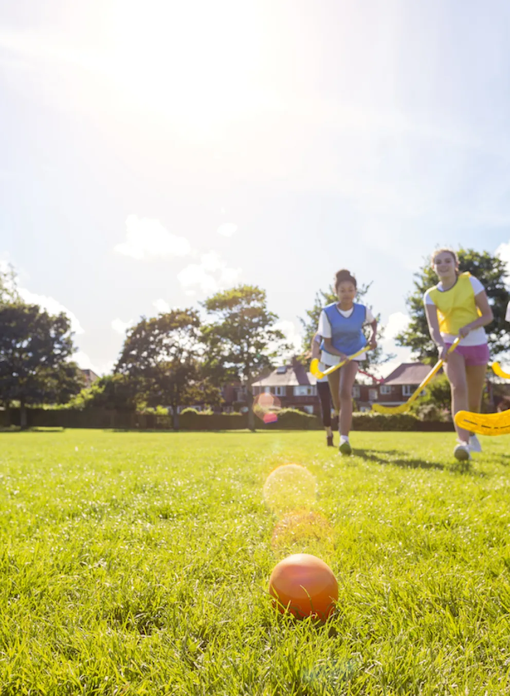 Kids playing in youth field hockey league game