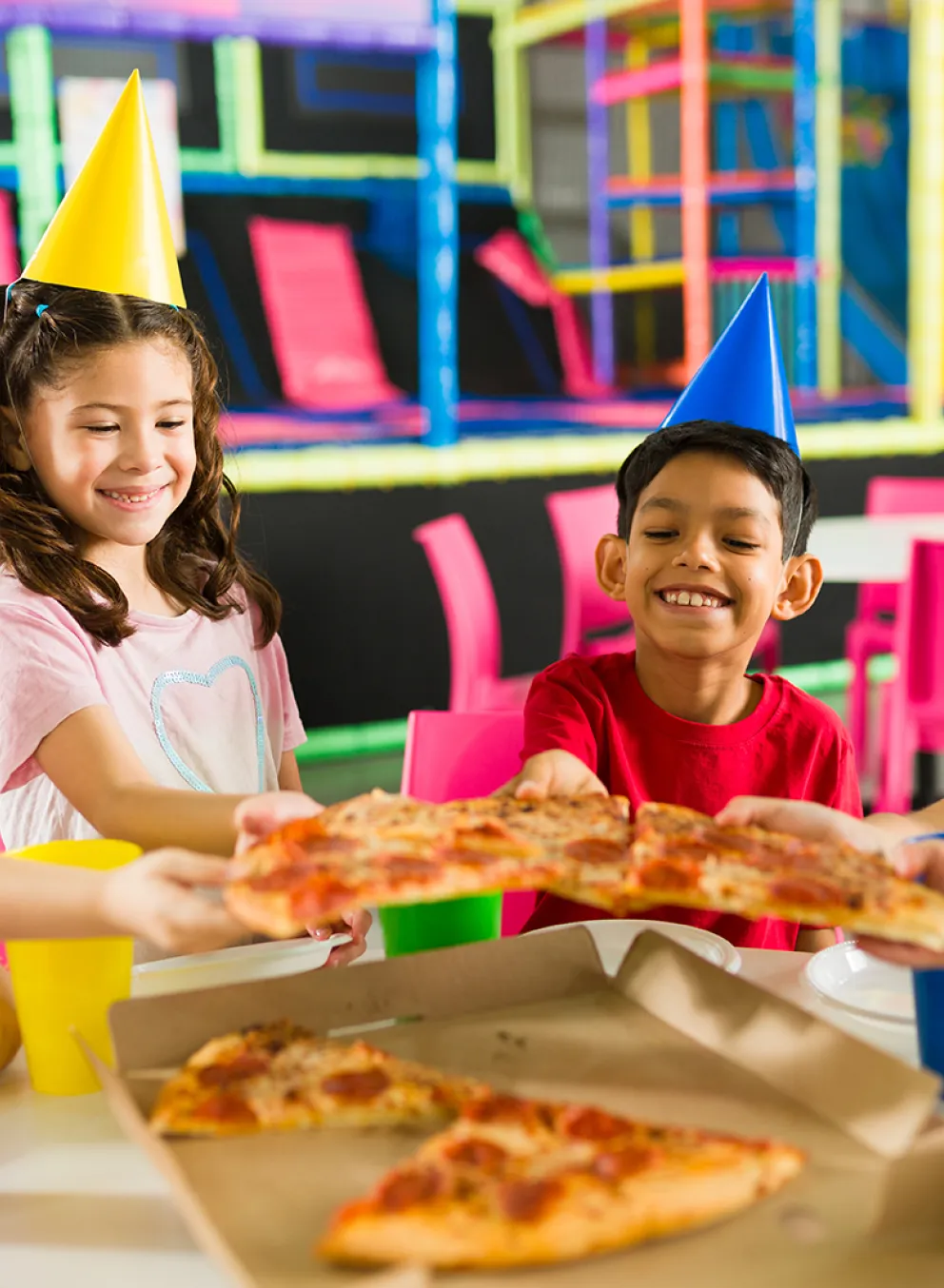 Kids with pizza at a birthday party