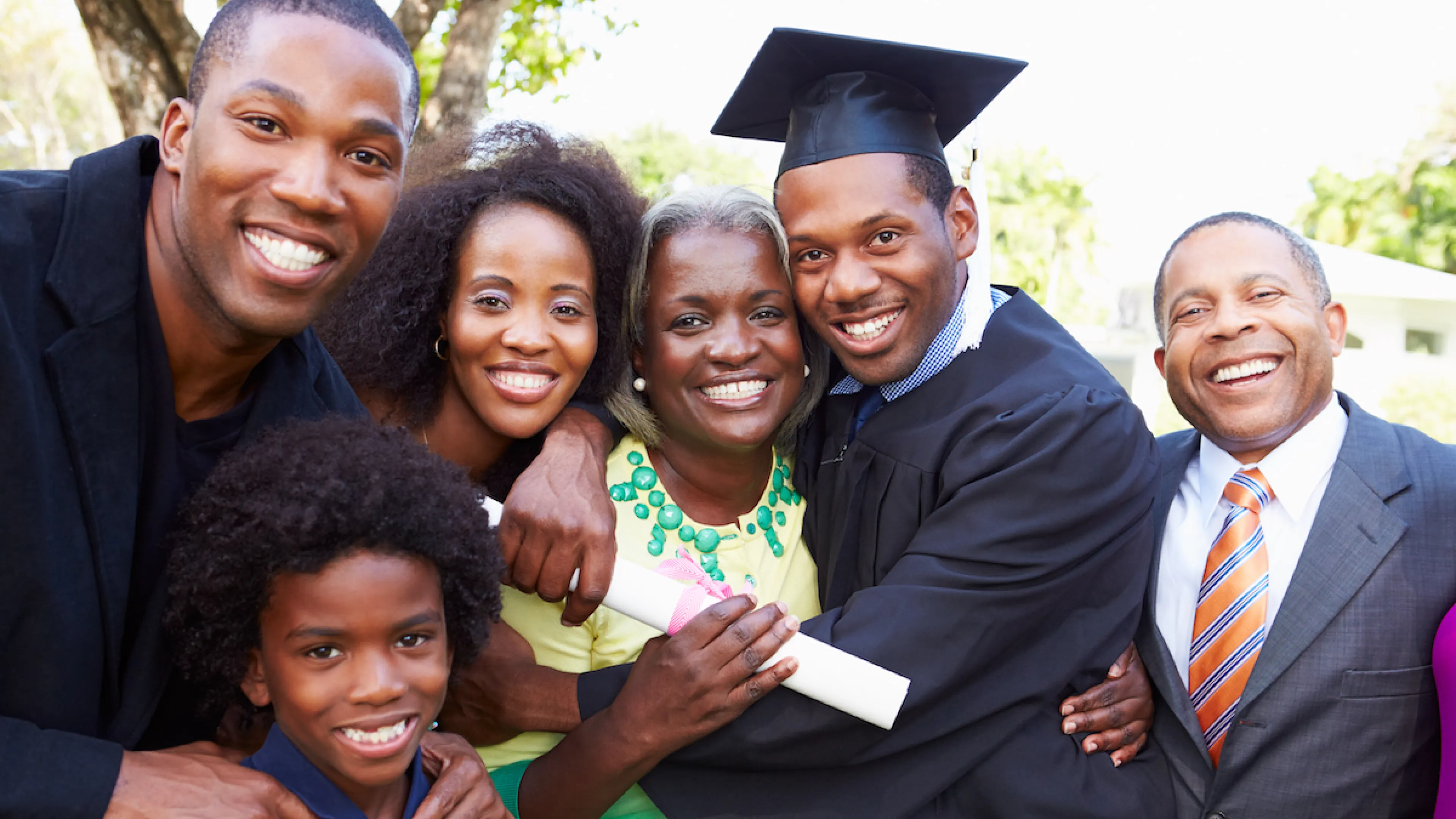 Family smiling together at graduation