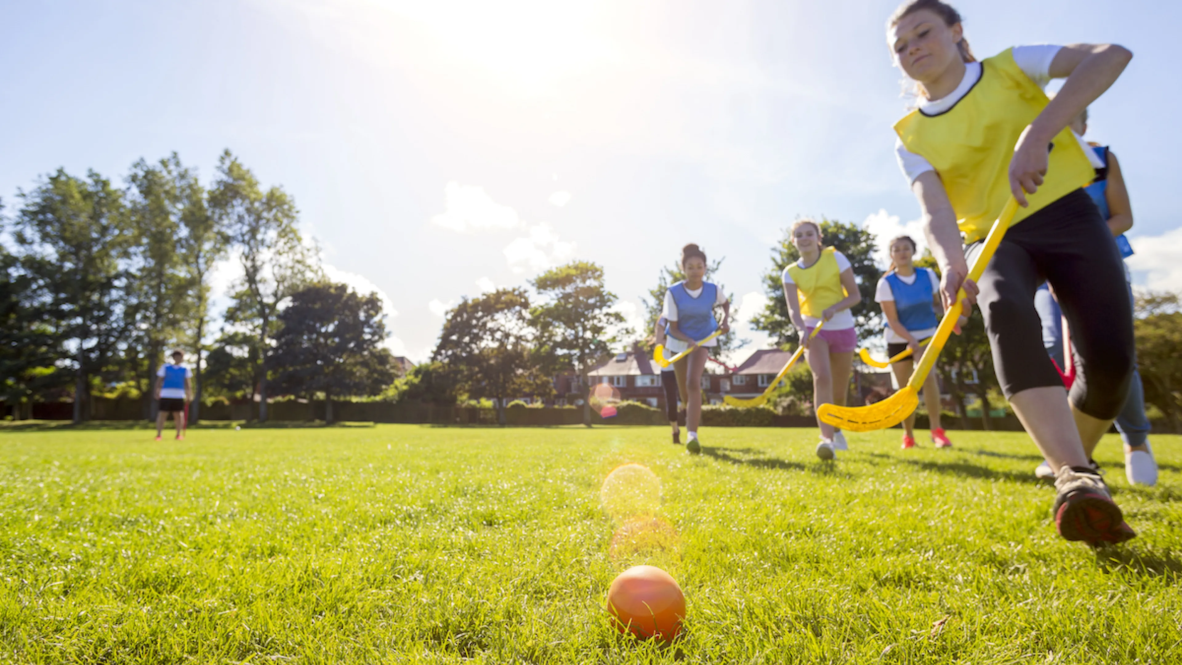 Kids playing in youth field hockey league game