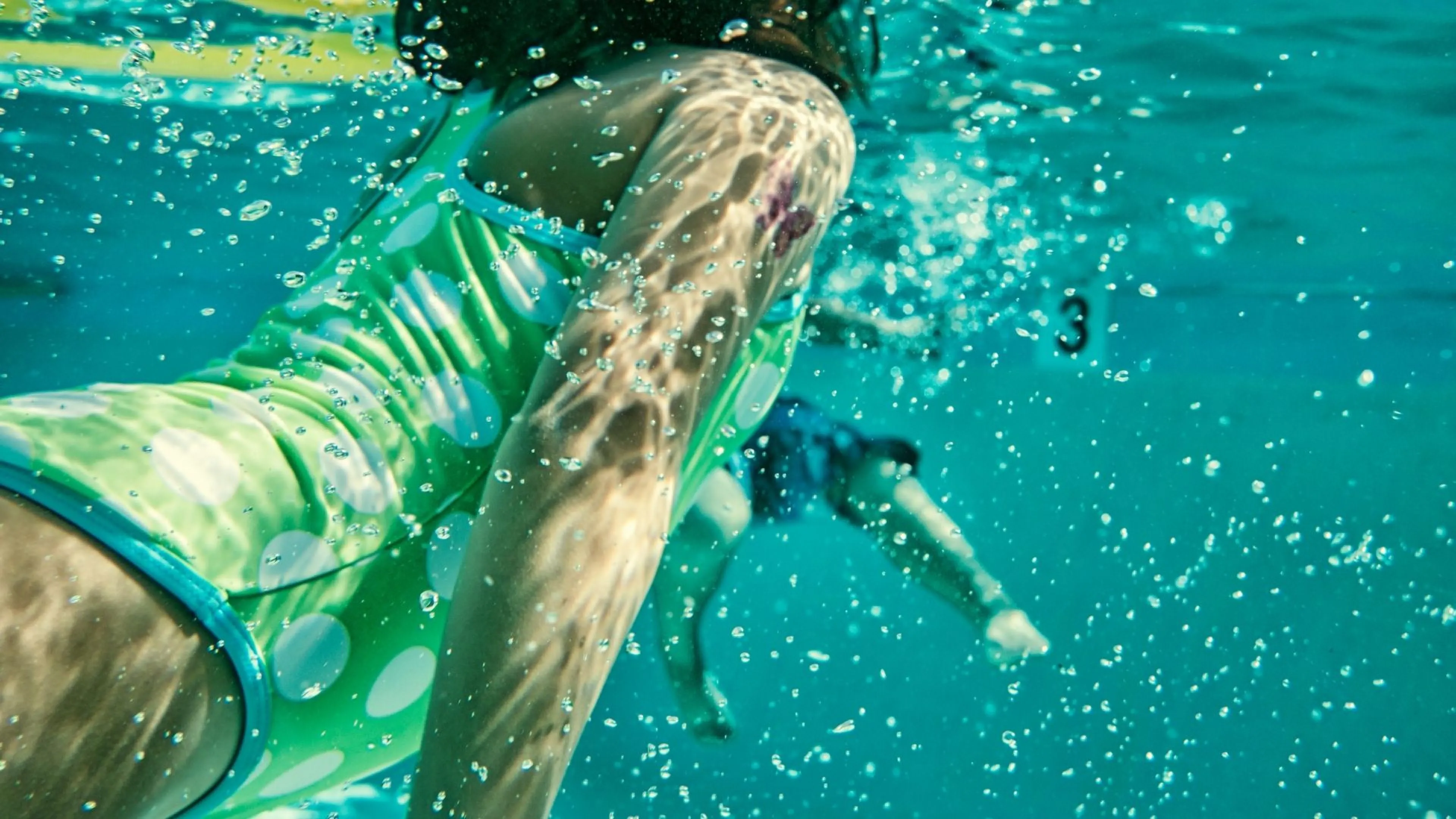 Girl in pool swimming