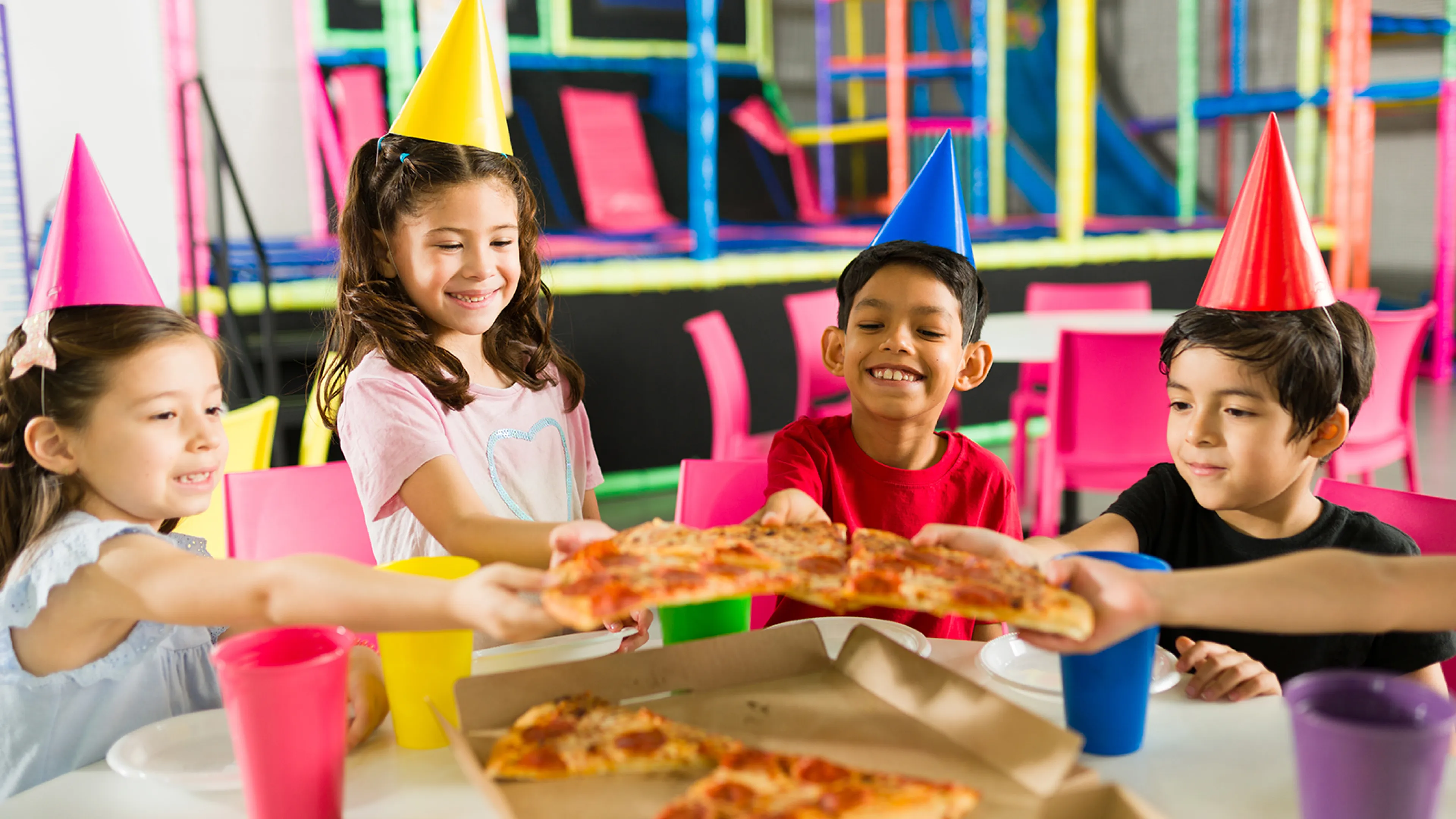Kids with pizza at a birthday party