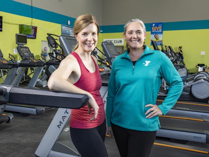 YMCA Lousiiville personal trainer talking with student